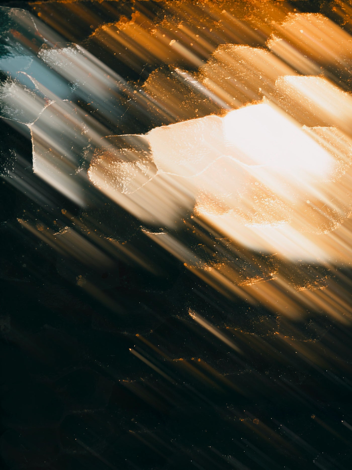 Rainlit Amber Drift - Blurred rain and warm light streaks in motion. Museum-grade framed artwork by Veriando Studio.