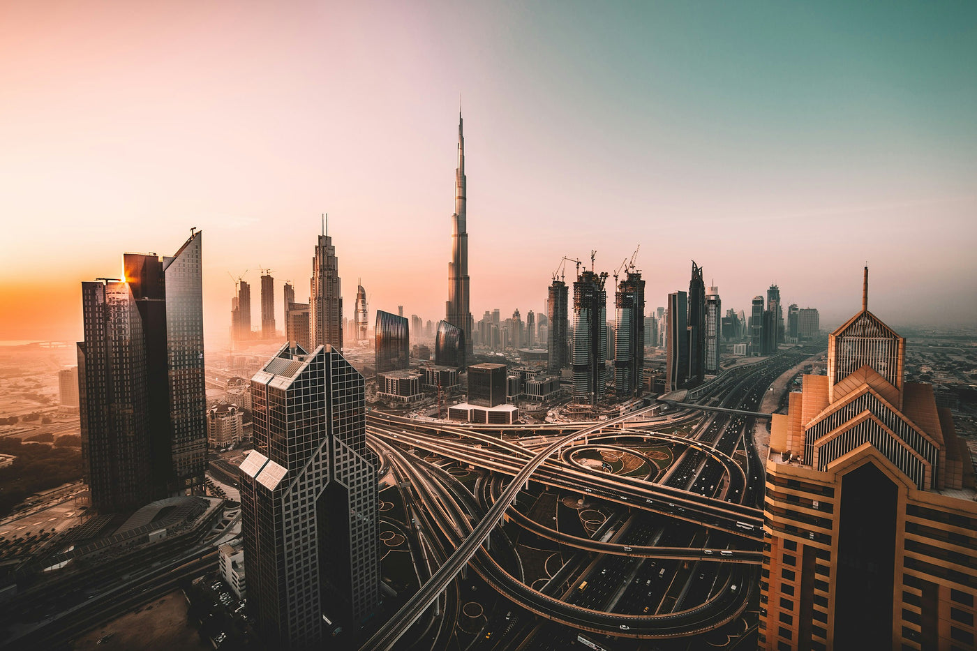 Dubai Afterglow - Dubai skyline and roadways glowing at sunset. Museum-grade framed artwork by Veriando Studio.