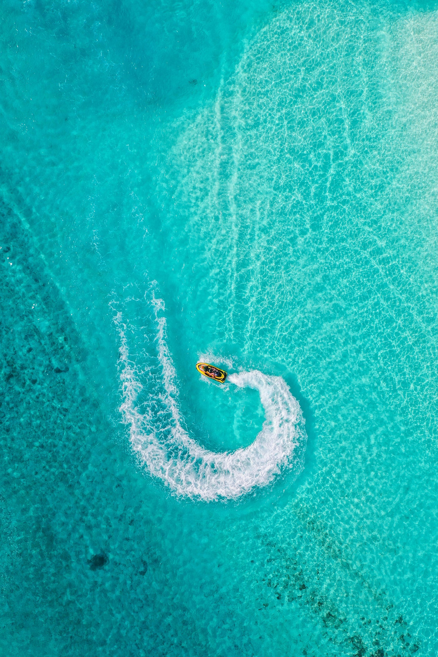 Turquoise Wake - Small boat drawing a white curve in turquoise water. Museum-grade framed artwork by Veriando Studio.