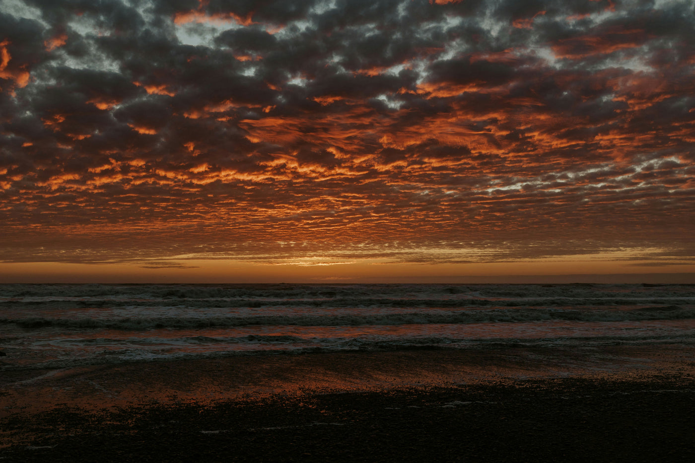 Ember Sea Horizon - Fiery sunset clouds above a dark sea horizon. Museum-grade framed artwork by Veriando Studio.