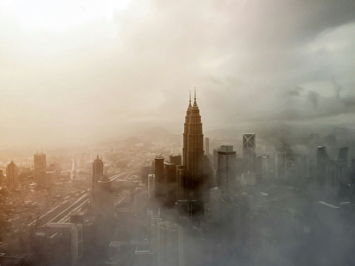 Burj in the Clouds - Burj Khalifa rising through fog and soft storm light. Museum-grade framed artwork by Veriando Studio.