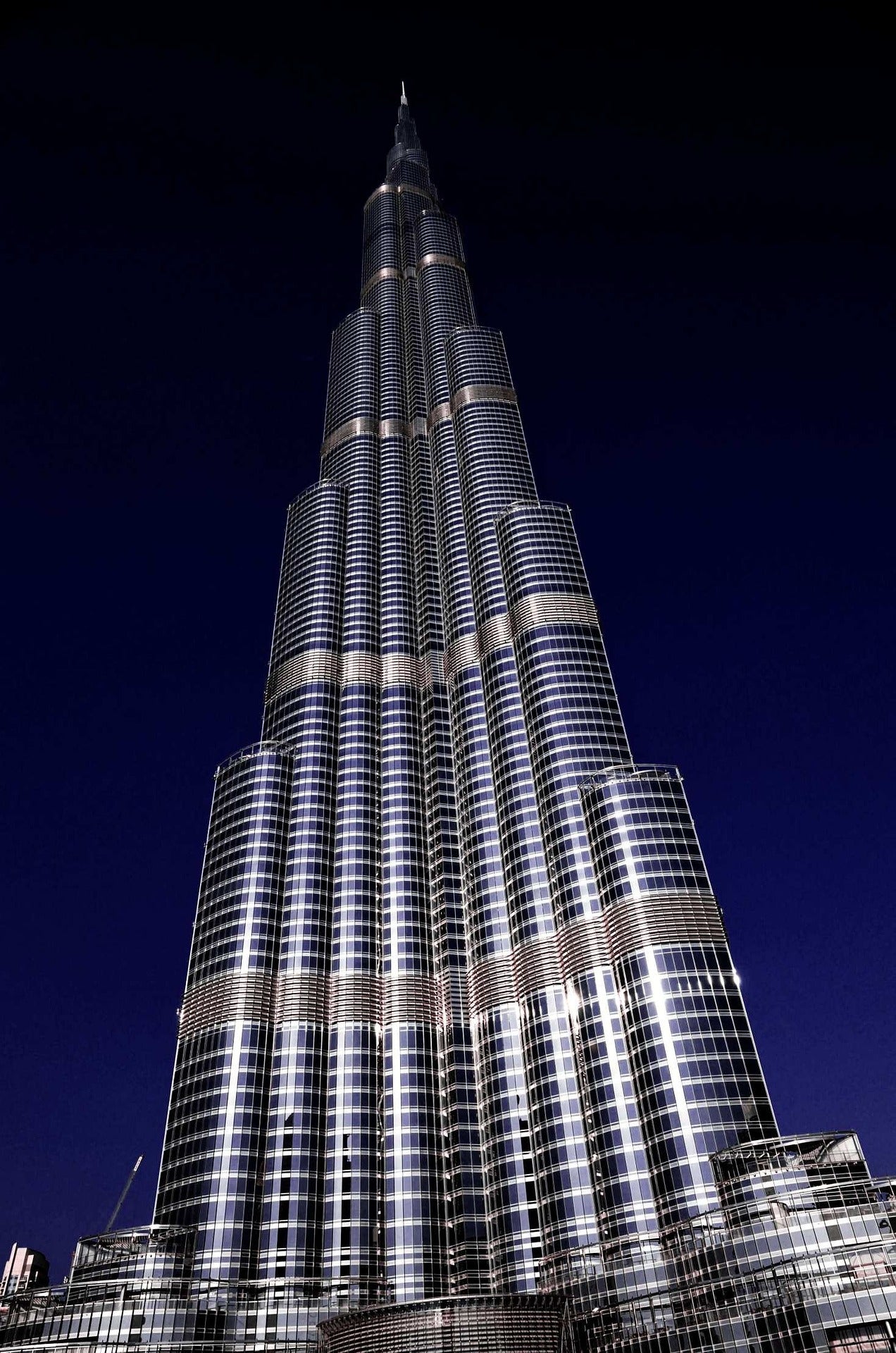 Burj Khalifa Midnight Spire - Burj Khalifa illuminated against deep night sky. Museum-grade framed artwork by Veriando Studio.
