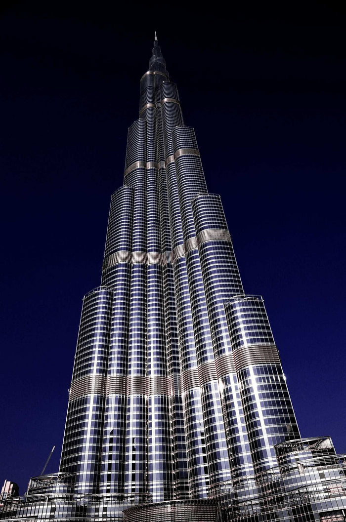 Burj Khalifa Midnight Spire - Burj Khalifa illuminated against deep night sky. Museum-grade framed artwork by Veriando Studio.