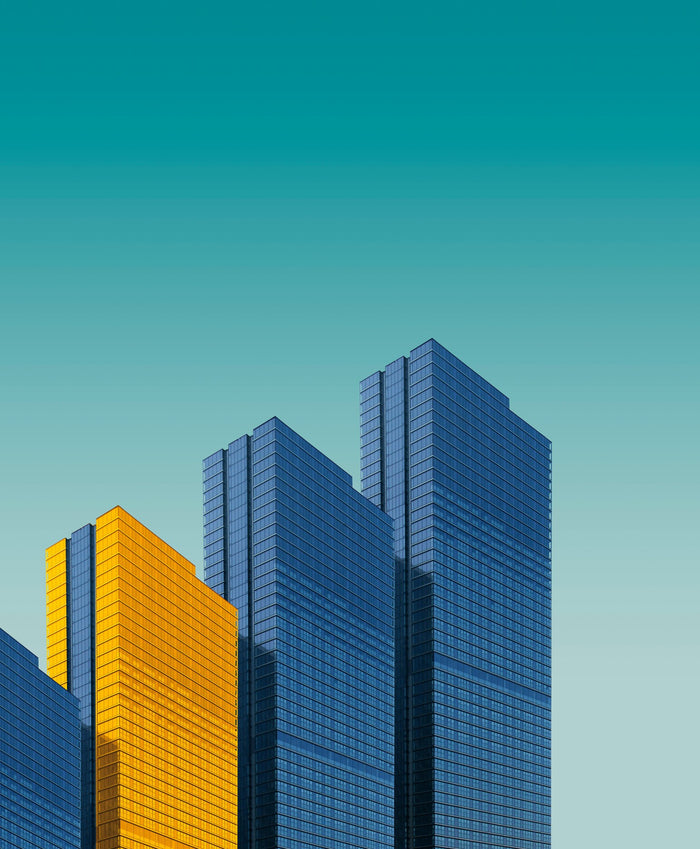 Cobalt and Gold Towers - Geometric modern towers with a yellow-gold facade. Museum-grade framed artwork by Veriando Studio.