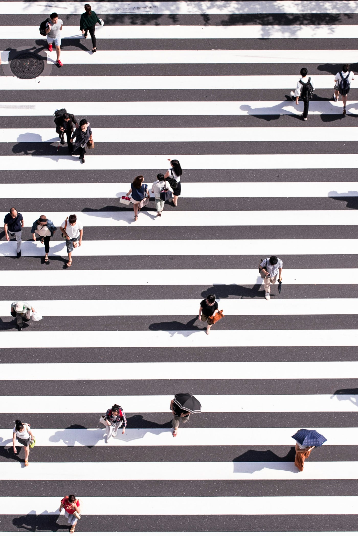Crossing Lines - Overhead pedestrian crossing with small human figures. Museum-grade framed artwork by Veriando Studio.