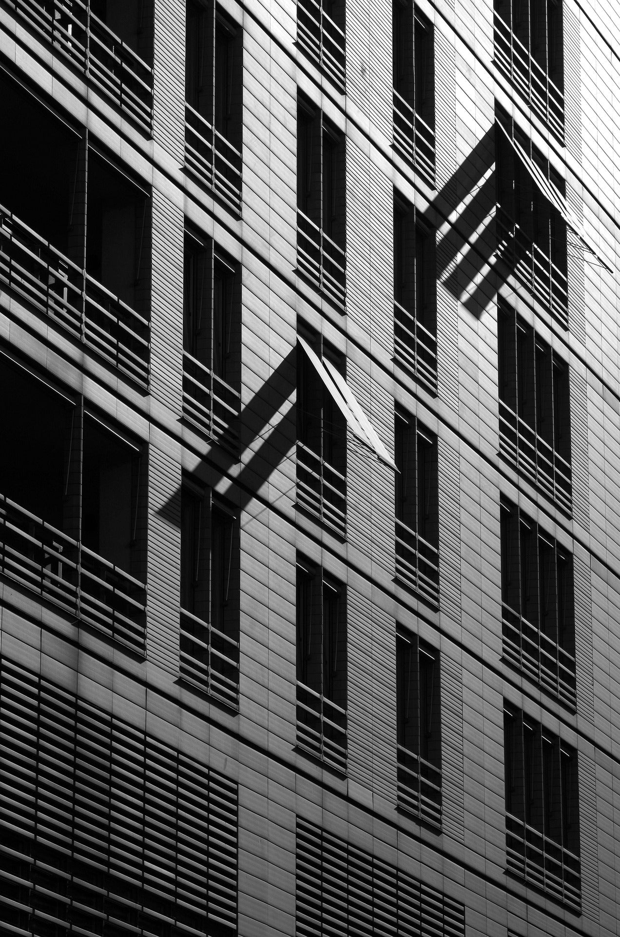 Monochrome Facade Rhythm - Black and white facade lines creating strong rhythm. Museum-grade framed artwork by Veriando Studio.