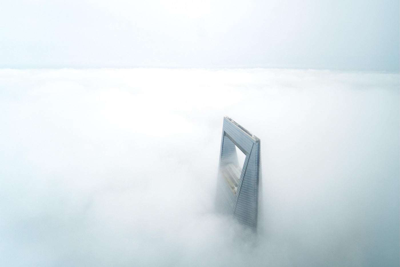 Tower Above the Mist - A tower emerging from a field of cloud or fog. Museum-grade framed artwork by Veriando Studio.