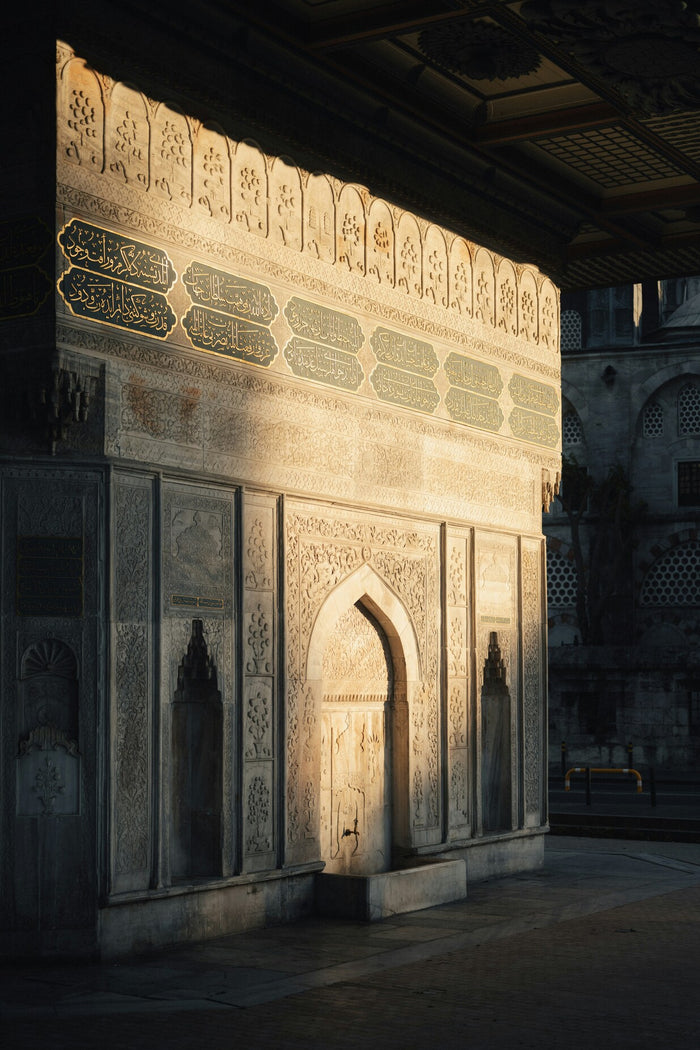 Carved Door of Light - Islamic carved doorway lit by warm sunlight. Museum-grade framed artwork by Veriando Studio.