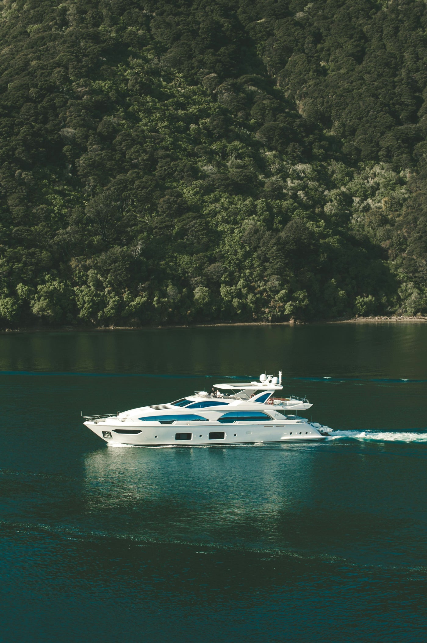 Yacht in Emerald Water - White yacht on dark green water. Museum-grade framed artwork by Veriando Studio.
