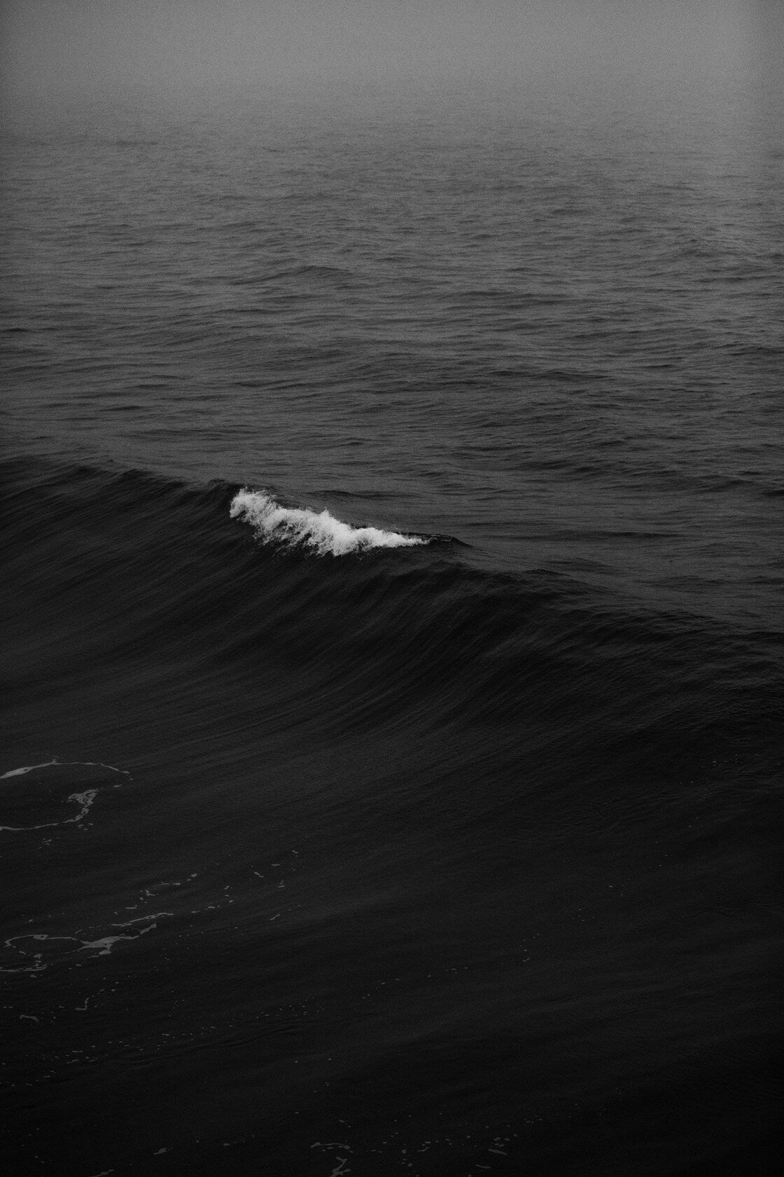 Black Sea Fold - Dark ocean wave folding in monochrome. Museum-grade framed artwork by Veriando Studio.