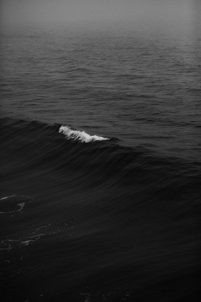 Black Sea Fold - Dark ocean wave folding in monochrome. Museum-grade framed artwork by Veriando Studio.