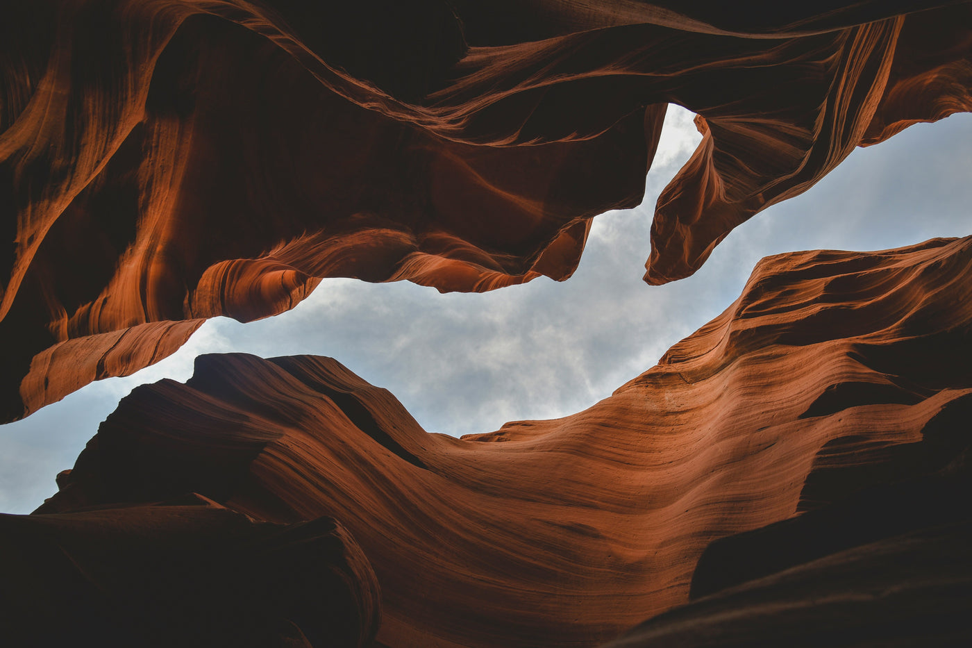 Canyon Light Passage - Warm canyon walls opening toward pale sky. Museum-grade framed artwork by Veriando Studio.