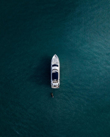 Lone Boat in Teal Water Warm room