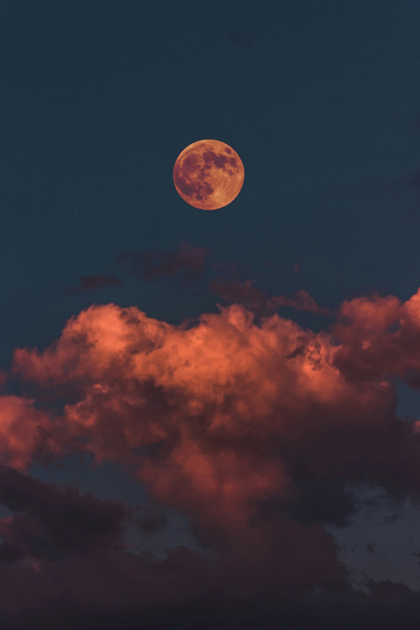 Moon over Burnt Clouds - Orange moon above dark red clouds. Museum-grade framed artwork by Veriando Studio.