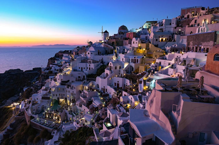 Santorini at Blue Hour - Cliffside white village at blue hour. Museum-grade framed artwork by Veriando Studio.