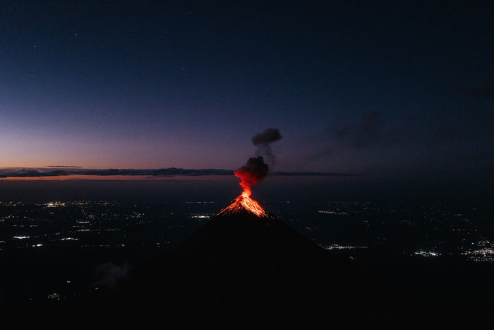 Volcano at Nightfall - Volcano glowing at night against a dark horizon. Museum-grade framed artwork by Veriando Studio.